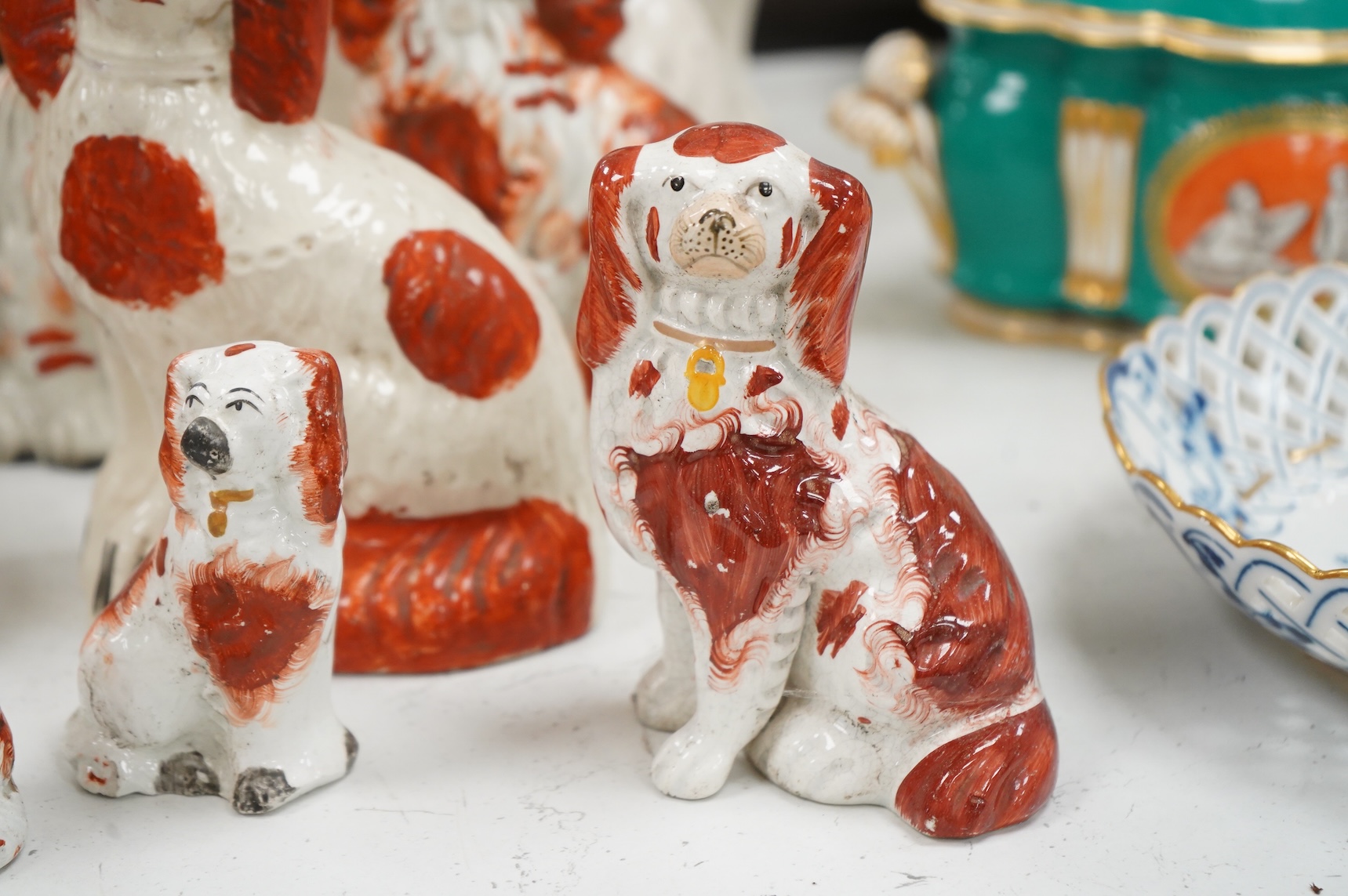 Nine different sized 19th century Staffordshire chimney dogs, tallest 23cm